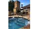 Community hot tub and fireplace with chairs and tables nearby at 3778 Rock Bridge Ne Dr, Conover, NC 28613