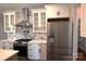 Modern kitchen featuring white cabinets, stainless steel appliances, and a marble countertop at 3778 Rock Bridge Ne Dr, Conover, NC 28613