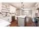 Open kitchen featuring white cabinets, stainless steel appliances, and a marble countertop island at 3778 Rock Bridge Ne Dr, Conover, NC 28613