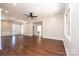 Spacious living room featuring hardwood floors, a ceiling fan, and a large window at 3778 Rock Bridge Ne Dr, Conover, NC 28613