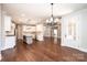 Open-concept living space featuring a modern kitchen with stainless steel appliances and hardwood floors at 3778 Rock Bridge Ne Dr, Conover, NC 28613