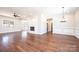 Spacious living room featuring hardwood floors, modern fireplace, neutral paint, and natural lighting at 3778 Rock Bridge Ne Dr, Conover, NC 28613
