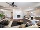 Bright living room with fireplace, ceiling fan, hardwood floors, and comfortable furniture at 3778 Rock Bridge Ne Dr, Conover, NC 28613