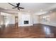 Spacious living room with hardwood floors, a ceiling fan, and open floor plan to other rooms at 3778 Rock Bridge Ne Dr, Conover, NC 28613