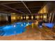 Indoor pool with waterfall feature and elegant lighting, perfect for year-round enjoyment at 3778 Rock Bridge Ne Dr, Conover, NC 28613