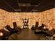 Relaxing salt room featuring lounge chairs, soft lighting, and unique salt brick walls at 3778 Rock Bridge Ne Dr, Conover, NC 28613