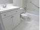 Bathroom showcasing a white vanity, toilet, and bathtub at 1300 Reece Rd # 302, Charlotte, NC 28209