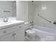 Bathroom featuring white vanity, toilet, and bathtub with safety bar at 1300 Reece Rd # 302, Charlotte, NC 28209