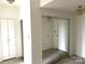 Bright bedroom featuring closet with mirrored sliding doors and neutral carpeting at 1300 Reece Rd # 302, Charlotte, NC 28209