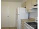 A kitchen with white appliances, cabinets, and light countertops at 1300 Reece Rd # 302, Charlotte, NC 28209