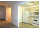 This kitchen has a stove, refrigerator, and off-white cabinetry at 1300 Reece Rd # 302, Charlotte, NC 28209