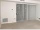 Bright Living Room featuring neutral carpeting and sliding door to balcony at 1300 Reece Rd # 302, Charlotte, NC 28209