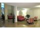 Spacious lobby with comfortable seating, plants, and modern lighting fixtures at 1300 Reece Rd # 302, Charlotte, NC 28209