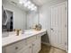 Bright bathroom with white vanity, tile floor, and large mirror at 6421 Chadwell Ct # 61, Fort Mill, SC 29707