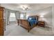 Comfortable bedroom with a king-size bed and wood framed nightstand at 6421 Chadwell Ct # 61, Fort Mill, SC 29707