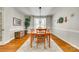 Dining room with wood table and chairs on an area rug at 6421 Chadwell Ct # 61, Fort Mill, SC 29707