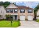 Brick two-story house with a two-car garage and landscaped front yard at 6421 Chadwell Ct # 61, Fort Mill, SC 29707