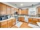 Well-equipped kitchen featuring stainless steel appliances, tile backsplash, and wooden cabinets at 6421 Chadwell Ct # 61, Fort Mill, SC 29707