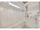 Close up of a sleek walk-in shower featuring a mosaic tile floor and modern fixtures at 6421 Chadwell Ct # 61, Fort Mill, SC 29707