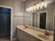 Bright bathroom featuring double sinks and a glass shower at 11311 Olde Turnbury Ct, Charlotte, NC 28277