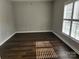 Bright bedroom featuring wood floors and a large window at 11311 Olde Turnbury Ct, Charlotte, NC 28277