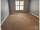 Bright bedroom with neutral walls and carpet floors at 11311 Olde Turnbury Ct, Charlotte, NC 28277