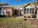 Charming brick home featuring a well-maintained front yard and inviting entrance at 11311 Olde Turnbury Ct, Charlotte, NC 28277