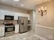 Well-equipped kitchen with stainless steel appliances and white cabinetry at 11311 Olde Turnbury Ct, Charlotte, NC 28277