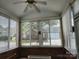 Sun-filled room with tile floor, many windows and views of the yard at 11311 Olde Turnbury Ct, Charlotte, NC 28277