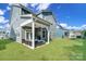 Backyard patio with seating area and partial home view at 1390 Cedardale Ln, Denver, NC 28037