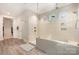 Spa-like bathroom with walk-in shower and tile flooring at 1390 Cedardale Ln, Denver, NC 28037