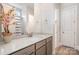 Bathroom with a single sink, grey cabinets and a shower/tub combo at 1390 Cedardale Ln, Denver, NC 28037