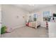 Bedroom with four-poster bed, desk and built-in shelving at 1390 Cedardale Ln, Denver, NC 28037