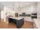 Spacious kitchen with large island, stainless steel appliances, and white cabinets at 1390 Cedardale Ln, Denver, NC 28037