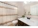 Cozy bathroom features a shower-tub combo, white sink, neutral paint, and earth-toned floors at 4741 Nijinsky Ct, Charlotte, NC 28216