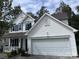 Attractive two-story home with a manicured lawn and an attached two-car garage at 4741 Nijinsky Ct, Charlotte, NC 28216