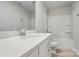 Bathroom with white counter, sink, mirror, toilet, and tub at 939 Cobbled Way, Fort Mill, SC 29715