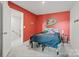 Red-walled bedroom with a double bed at 939 Cobbled Way, Fort Mill, SC 29715