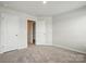 Neutral bedroom with carpet, white trim, and a doorway to hall at 939 Cobbled Way, Fort Mill, SC 29715