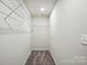 Walk-in closet includes shelving and carpeted floor at 939 Cobbled Way, Fort Mill, SC 29715