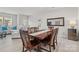 Bright dining area with wood table and seating for six at 939 Cobbled Way, Fort Mill, SC 29715