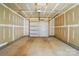 Spacious garage awaiting finishing touches, perfect for storage or a workshop at 939 Cobbled Way, Fort Mill, SC 29715