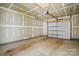 Unfinished two-car garage with a garage door opener at 939 Cobbled Way, Fort Mill, SC 29715