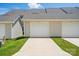 Modern home exteriors featuring individual garages, green lawns, and a clean, contemporary design at 939 Cobbled Way, Fort Mill, SC 29715