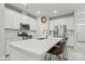 Modern kitchen with white cabinets, stainless steel appliances, and kitchen island at 939 Cobbled Way, Fort Mill, SC 29715