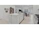 Modern kitchen with white island, stainless steel appliances, and open layout at 939 Cobbled Way, Fort Mill, SC 29715