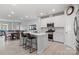 Modern kitchen with white cabinets, island, and stainless steel appliances at 939 Cobbled Way, Fort Mill, SC 29715