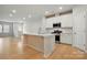 Modern kitchen with white cabinets, stainless steel appliances, and an island at 939 Cobbled Way, Fort Mill, SC 29715