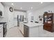 Modern kitchen featuring white cabinets, stainless steel appliances, and an island at 939 Cobbled Way, Fort Mill, SC 29715