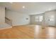 Bright and airy living room featuring wood floors, stairs and a front door at 939 Cobbled Way, Fort Mill, SC 29715